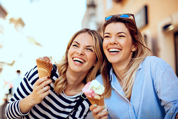two women enjoying ice cream