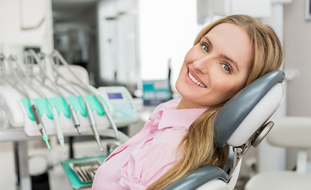 smiling woman sitting in a dental chair