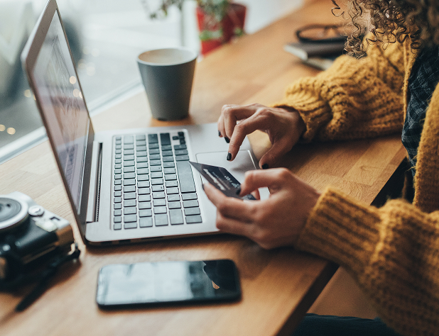 someone paying bills at a computer